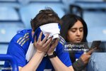 leicester-england-a-leicester-city-fan-looks-dejected-after-their-sides-defeat-resulting-in.jpg