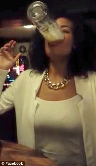1411652688233_wps_24_Woman_drinks_pint_in_5_se.jpg