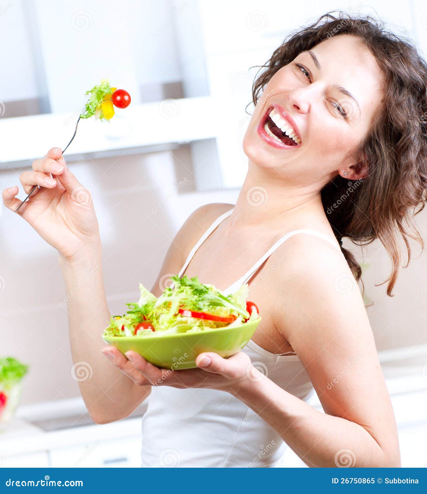 diet-woman-eating-vegetable-salad-26750865.jpg